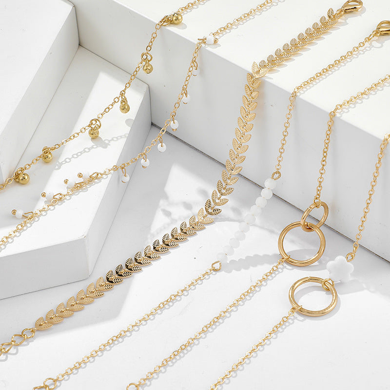 Upgrade Your Jewelry Game with 6-Piece Stackable Chain Bracelet Set Featuring Hollow Out Geometry and Adjustable Tassel
