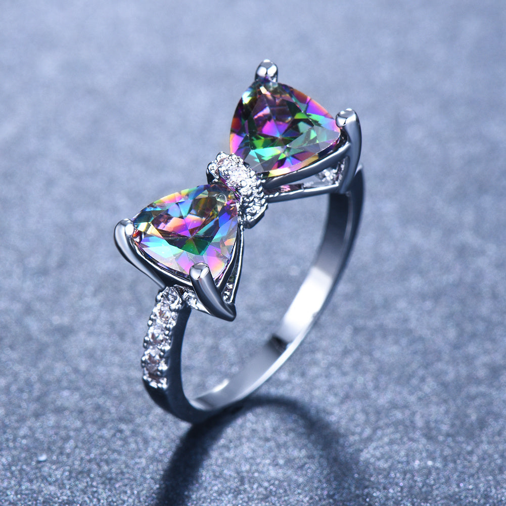 Sparkle on Your Special Day with Our White Crystal Marriage Ring - Ladies Silver Four Claw Bow Ring with Geometric Zircon Design - Perfect Birthday, Engagement or Wedding Gift for Women - Elegant Rhinestone Jewelry Accessory
