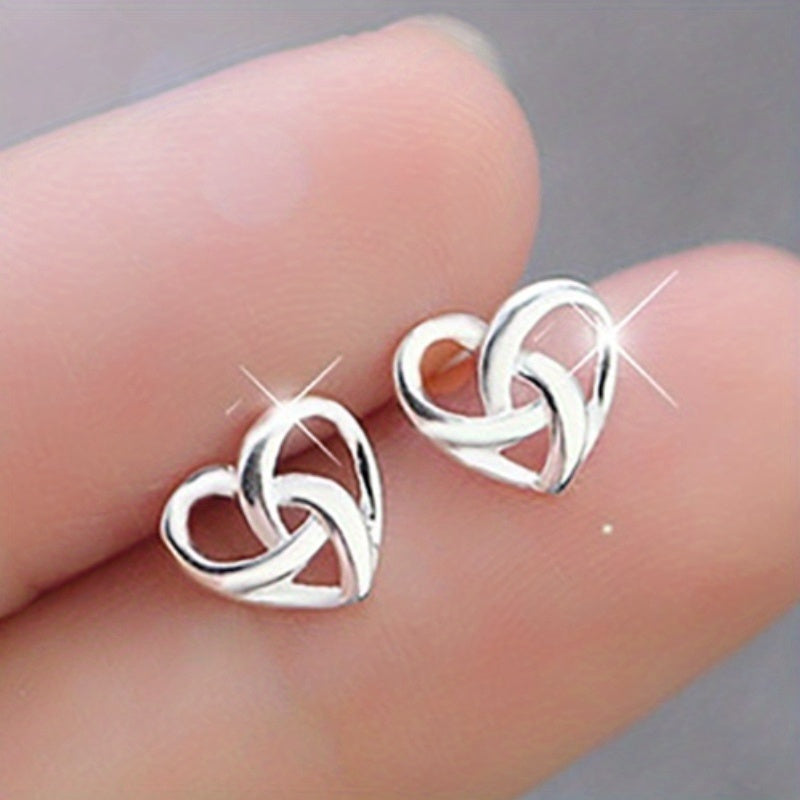 Add a Touch of Love to Your Daily Look with our Hollow Silvery Heart Knotted Stud Earrings
