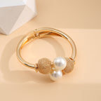 Make a Statement with our Exaggerated Alloy Open Bangle Bracelet Adorned with Large Faux Pearls
