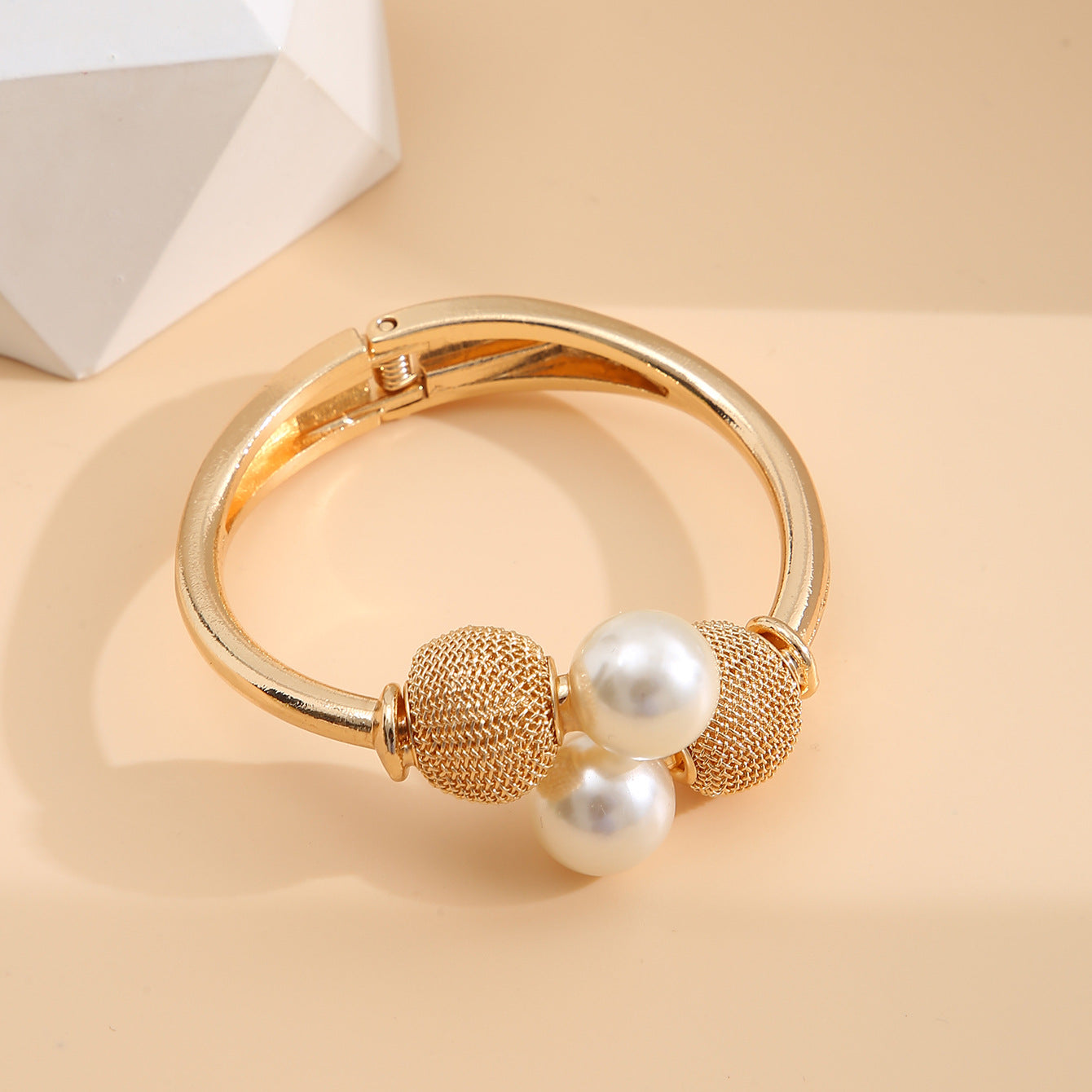 Make a Statement with our Exaggerated Alloy Open Bangle Bracelet Adorned with Large Faux Pearls