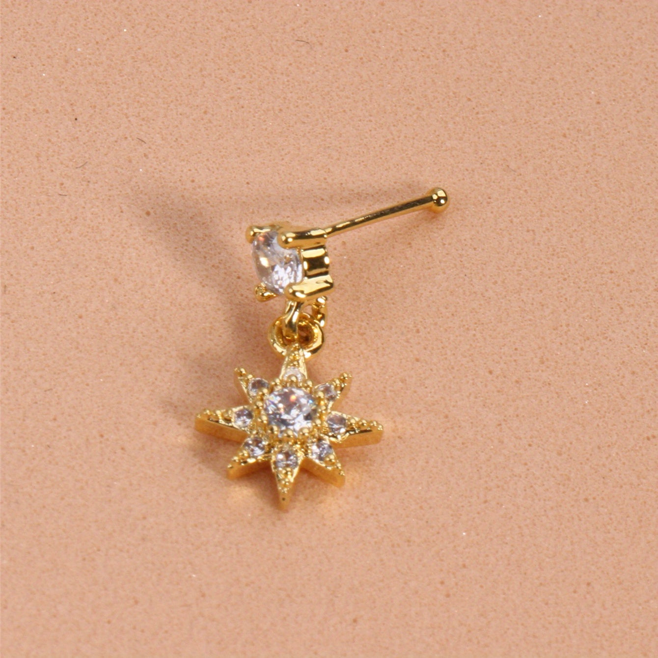 Add a touch of sunshine to your look with our Sun Pendant Nose Ring Stud featuring Shiny Zircon Inlay
