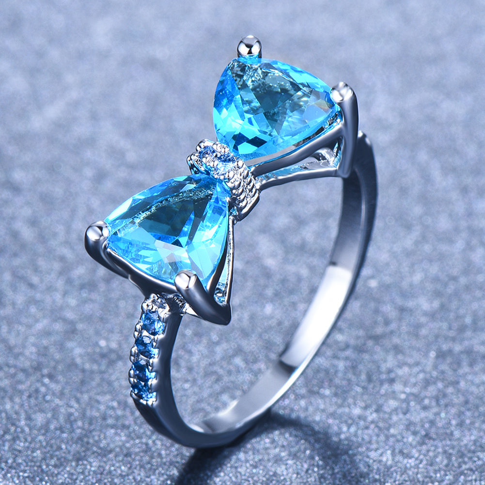 Sparkle on Your Special Day with Our White Crystal Marriage Ring - Ladies Silver Four Claw Bow Ring with Geometric Zircon Design - Perfect Birthday, Engagement or Wedding Gift for Women - Elegant Rhinestone Jewelry Accessory