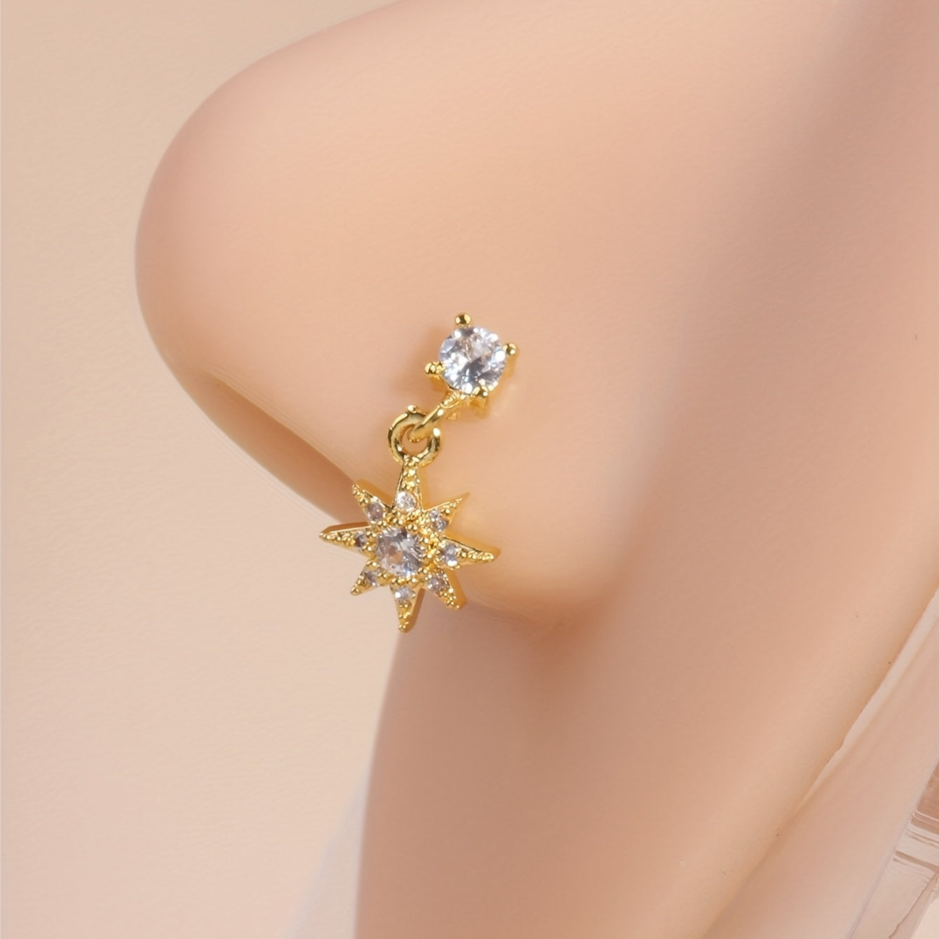 Add a touch of sunshine to your look with our Sun Pendant Nose Ring Stud featuring Shiny Zircon Inlay
