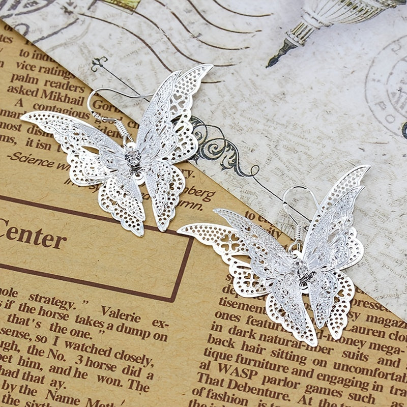 Add a Touch of Charm to Your Look with Women's Delicate Hollow Out Butterfly Hook Earrings - Silver Plated