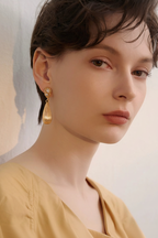 Gold Ribbed Teardrop CZ Stud Drop Earrings on Model